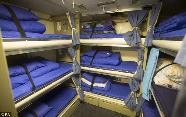 Crew members live in confined cabins on board the sub