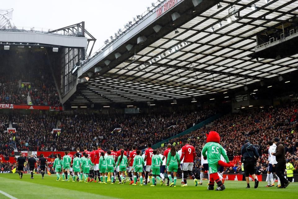  Man United and their mascots wore special shirts on the day at Old Trafford