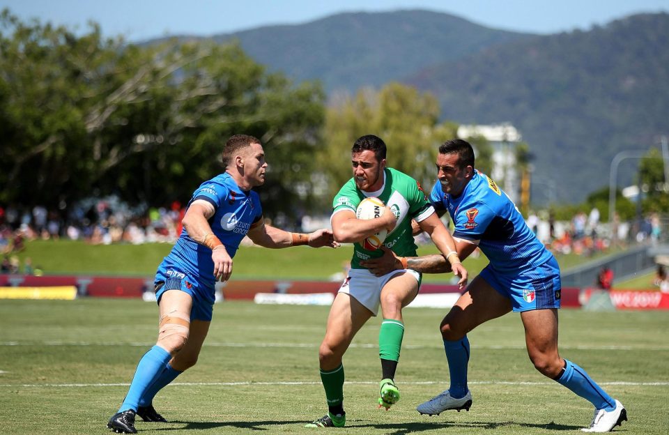  Api Pewhairangi tries to go past two Italian players, but is stopped in World Cup clash