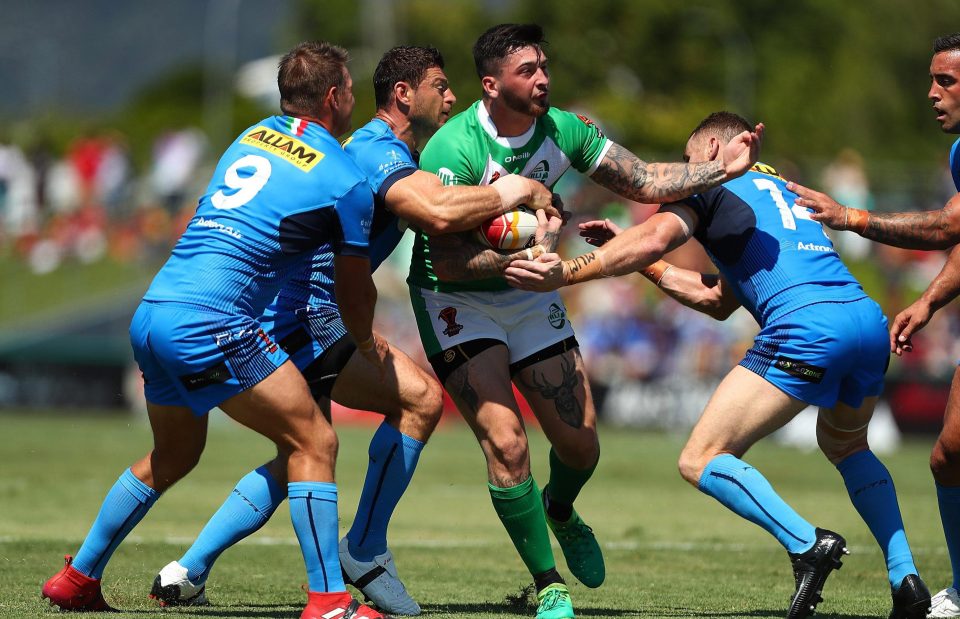  Ireland's Oliver Roberts is tackled during the victory over Italy in Cairns