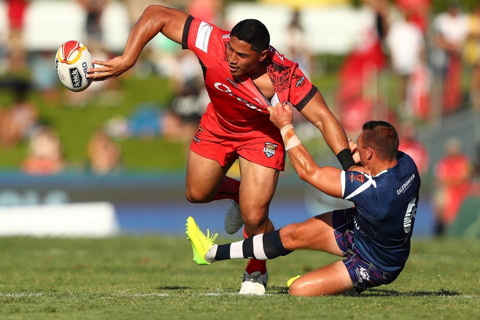  Jason Taumalolo passes the ball during Tonga's massive win over Scotland