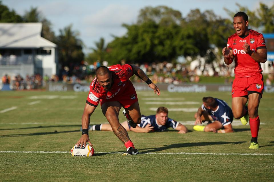  Tonga's Sika Manu breaks to score a try against Scotland at World Cup