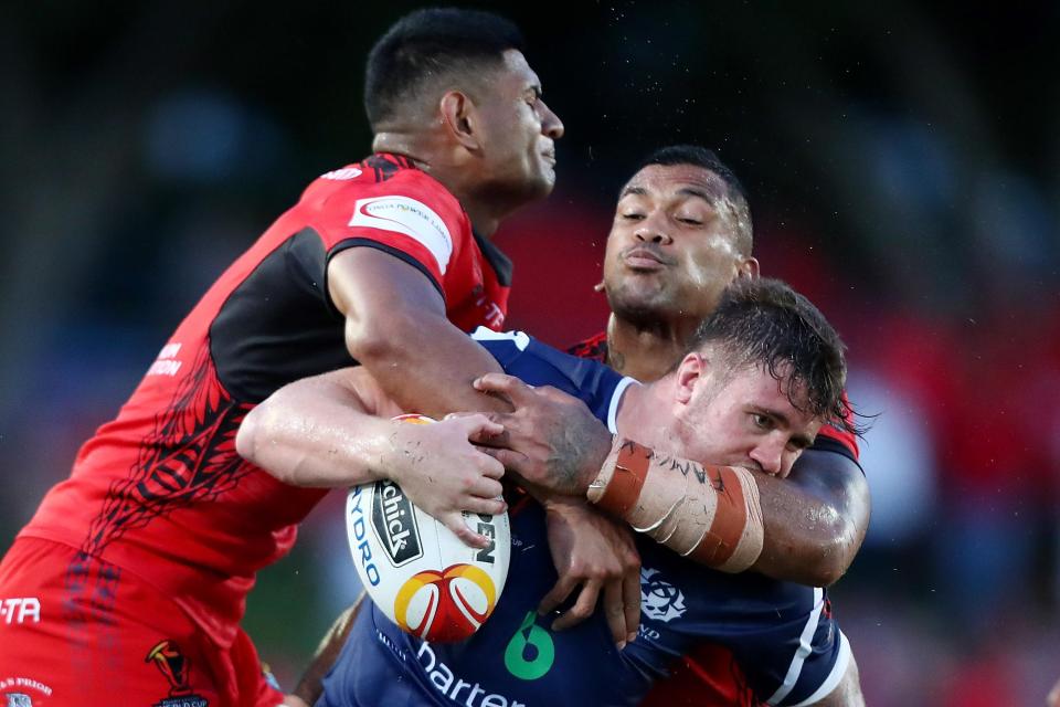  Scotland's Ben Hellewell is tackled as Tonga humble Scots in Cairns