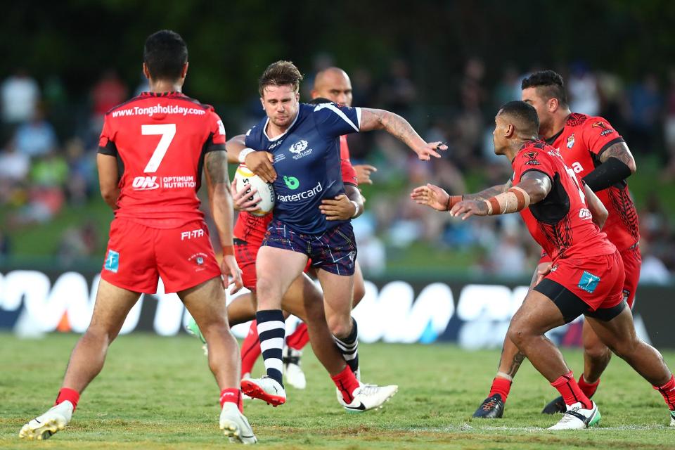  Scotland's Ben Hellewell is tackled during humblind against Tonga in Cairns