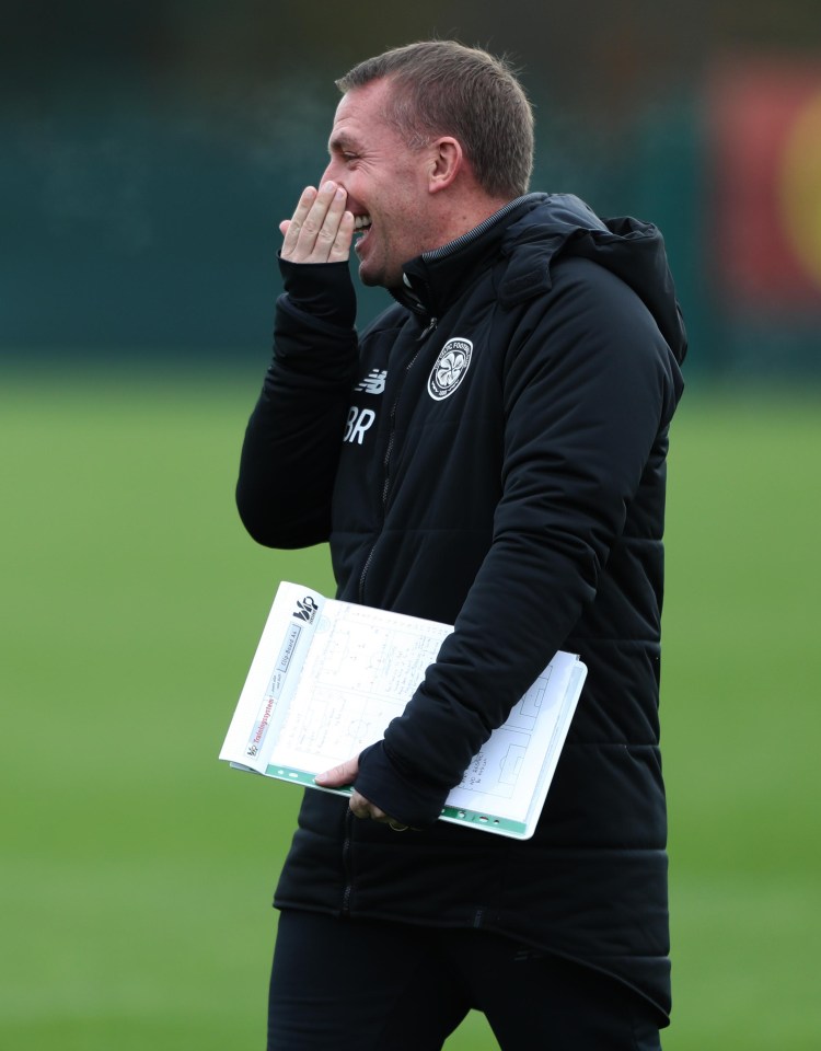 Brendan Rodgers smiles as he issues instructions