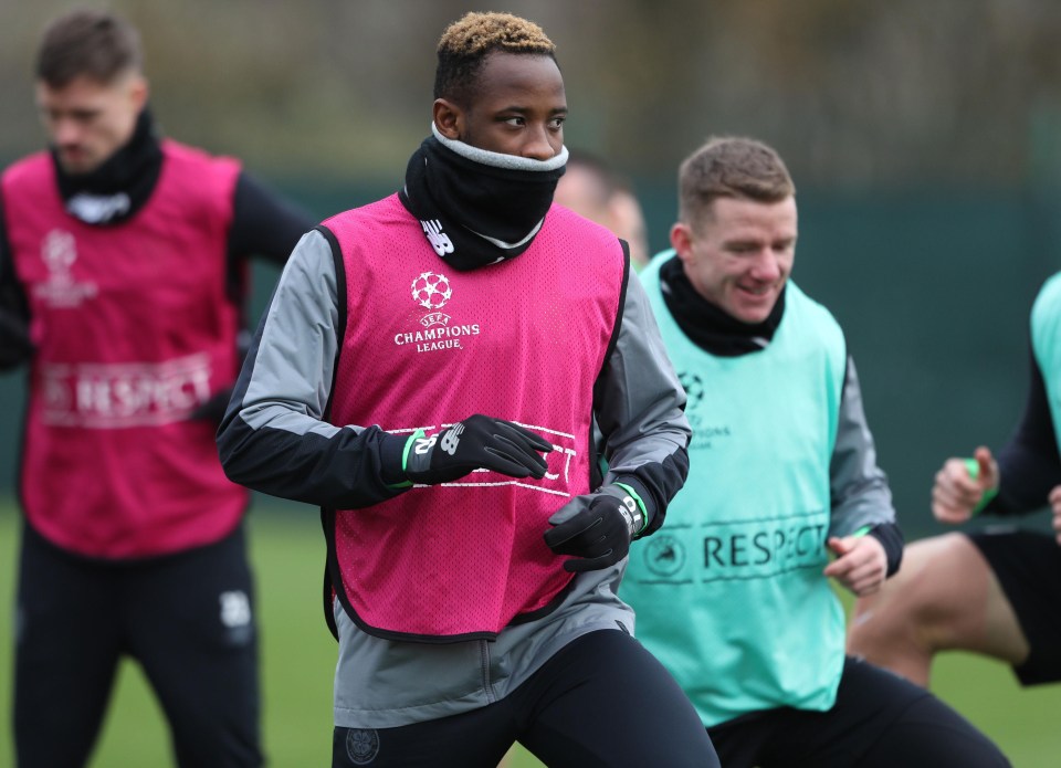 Moussa Dembele does his best to keep warm in Celtic training