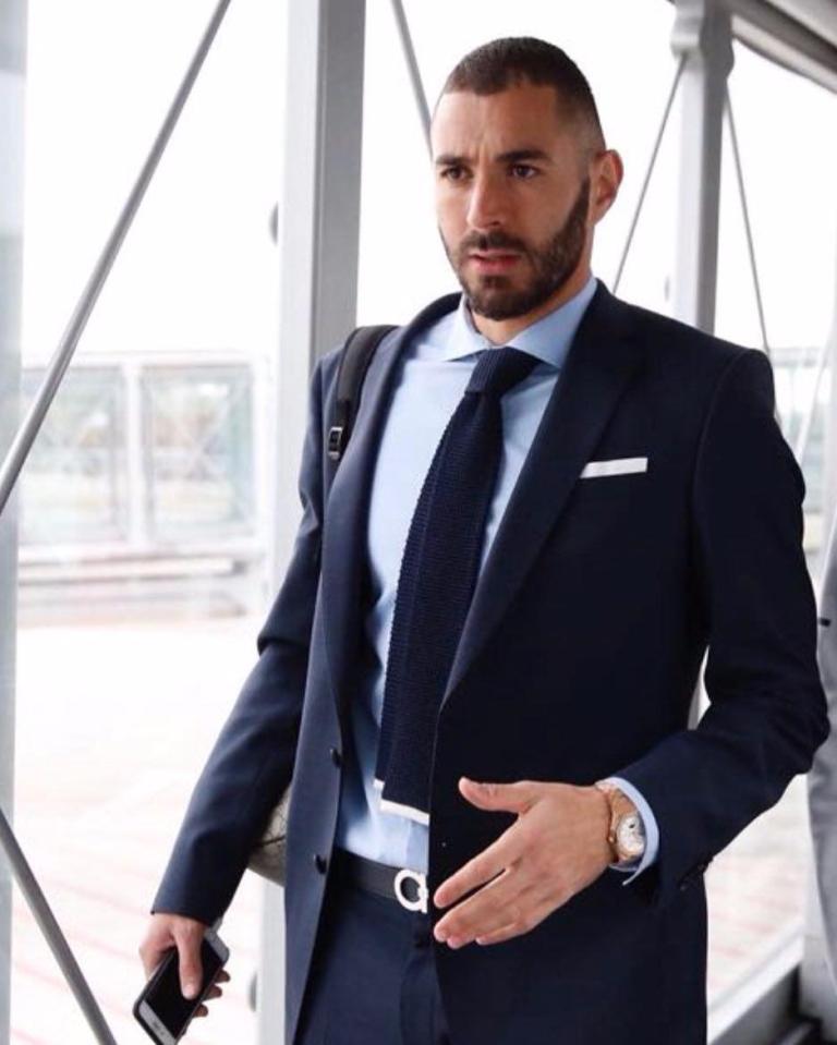  Karim Benzema walks down the gangway to the plane in Madrid