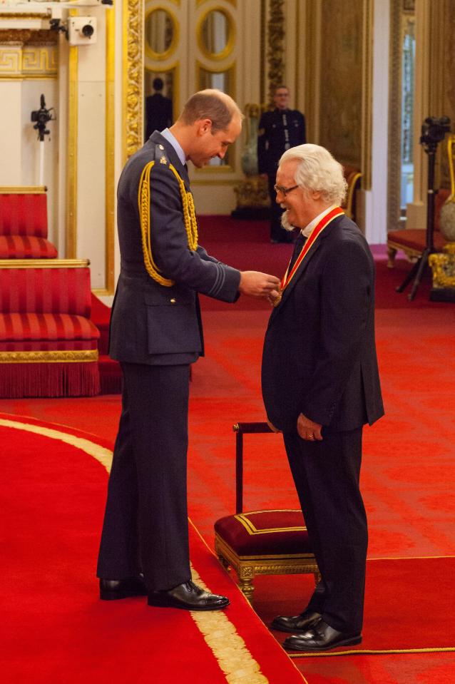  Prince William and Billy Connolly share a light-hearted moment as the comic is knighted