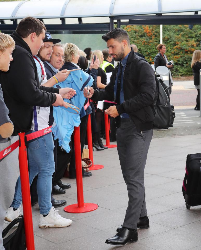  Sergio Aguero signs autographs as he greets fans at the airport