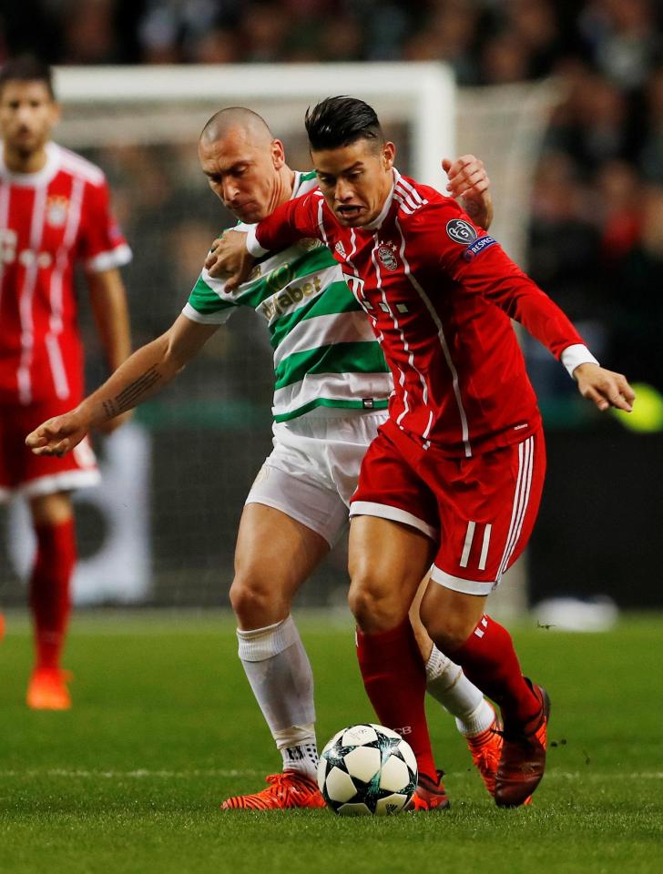  James Rodriguez is challenged by Celtic skipper Scott Brown