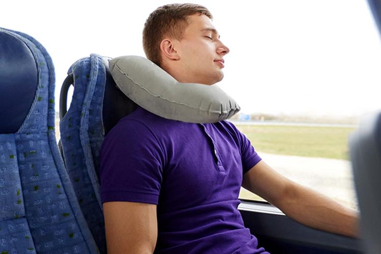  If you have a U-shaped neck pillow, turn it around so the bottom of the U is under your chin