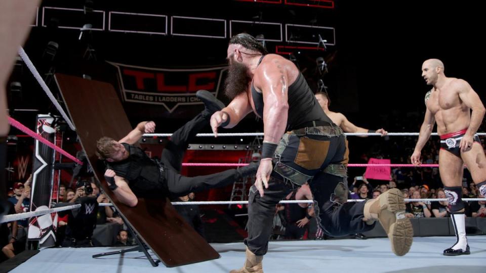  Strowman tosses Ambrose through a table