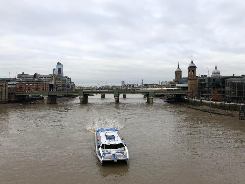  A view of a grey morning taken from London Bridge. You can see St. Paul's Cathedral on the right