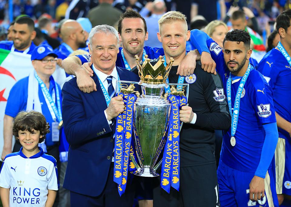  Christian Fuchs and Claudio Ranieri celebrate after clinching a historic Premier League title