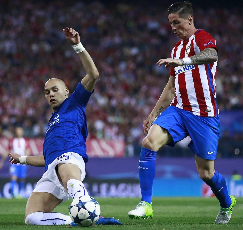  The Leicester defender does well to hold up Atletico Madrid striker Fernando Torres