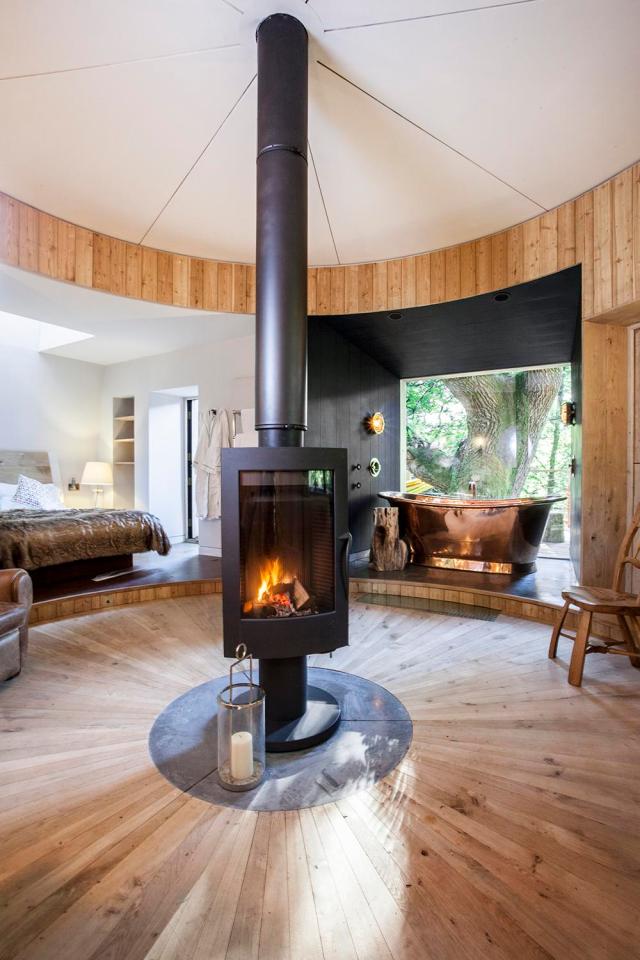  The stunning wooden interior circles a cosy woodburner heating the incredible property