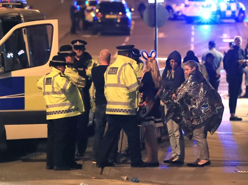 Survivors standing outside the arena on the night of the horrific attack