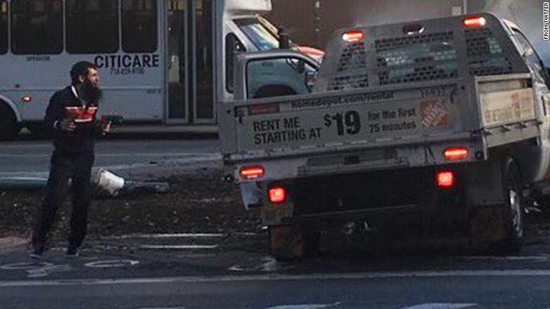  Saipov, pictured in the street moments before being shot in the stomach by cops