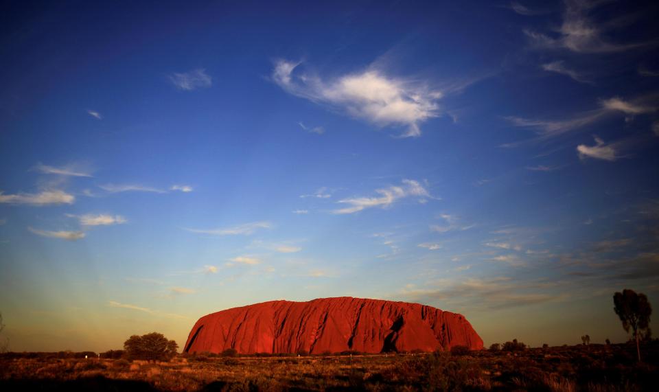  Tourists visiting Uluru, also known as Ayers Rock, will be banned from climbing it after October, 2019