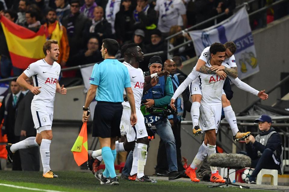  Spurs celebrate after taking the lead against the defending champions