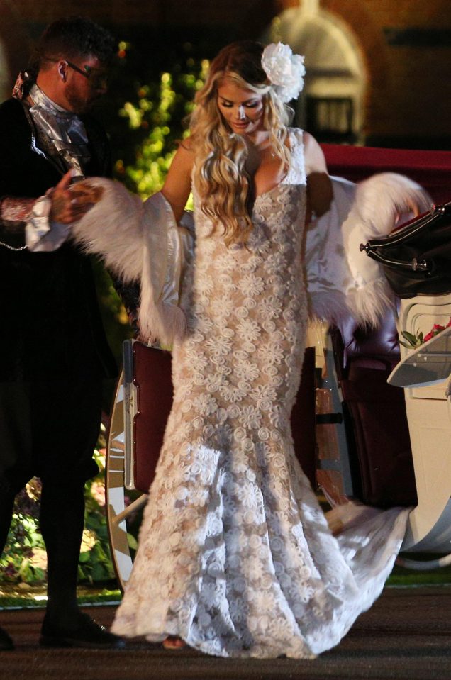  Chloe looked sensational in a white lace dress and faux fur stole