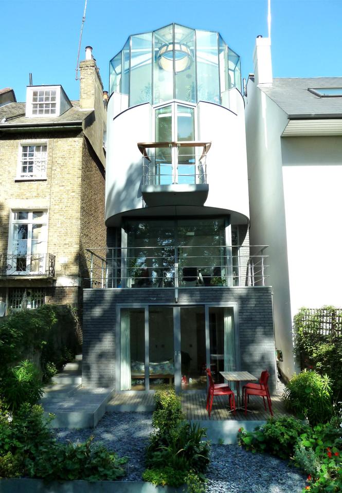  The unusually curved property is worlds apart from the classic North London homes it sits next to