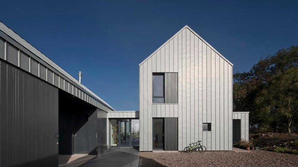  The two-storey home clusters around a three-sided courtyard