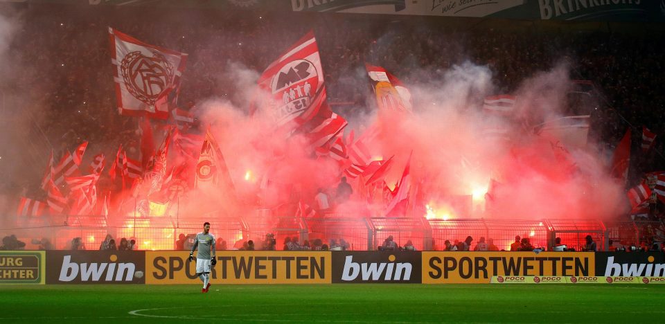  Bayern Munich fans let off flares during the 3-1 win at Borussia Dortmund