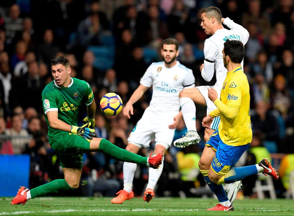  Las Palmas keeper Raul Lizoain Cruz blocks this shot from Real legend Cristiano Ronaldo