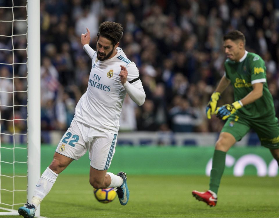  Spain midfielder Isco wheels away to hail the goal that sealed a 3-0 win for Real