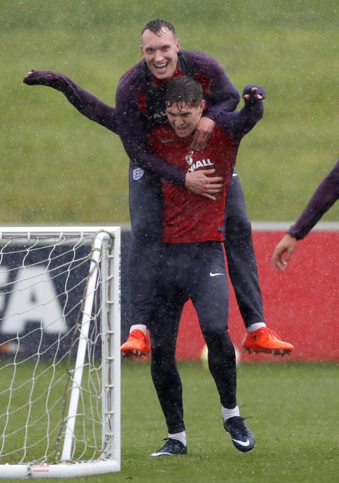  Manchester United and City stars Phil Jones and John Stones put their rivalry aside during England training