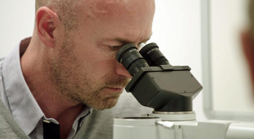  Alan Shearer looks at test results at the Queen Elizabeth University Hospital