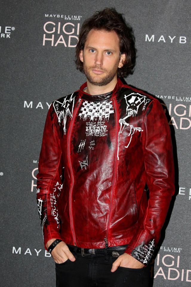  Marc Jacques Burton went grunge in a unique deep red leather jacket that had been etched with a personalised design