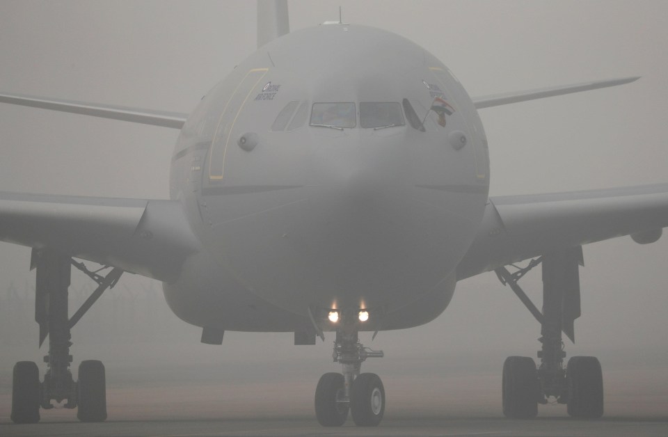 Charles’ jet pictured touching down in the terribly polluted Indian capital