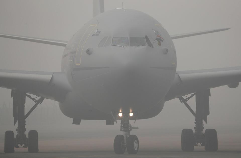  Charles' jet pictured touching down in the terribly polluted Indian capital