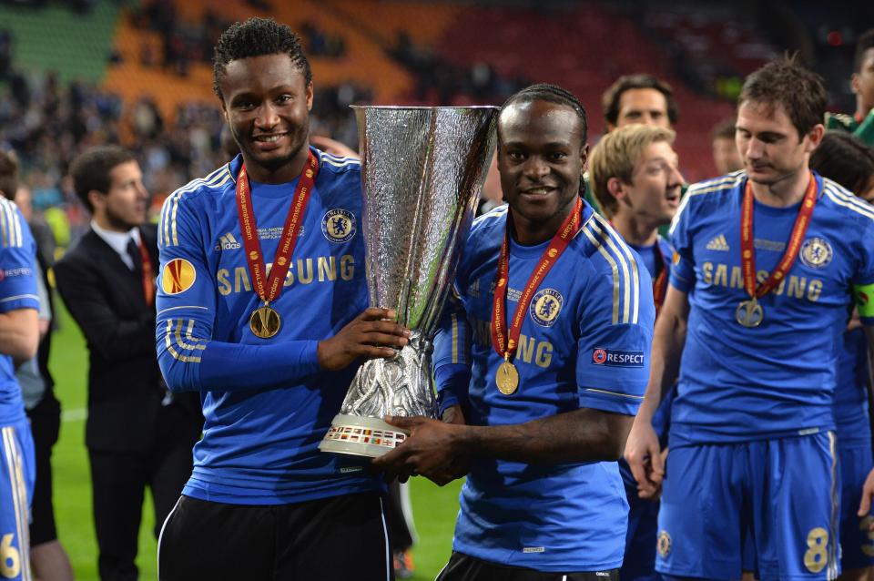  Mikel poses for the camera with team-mate Victor Moses after winning the Europa League