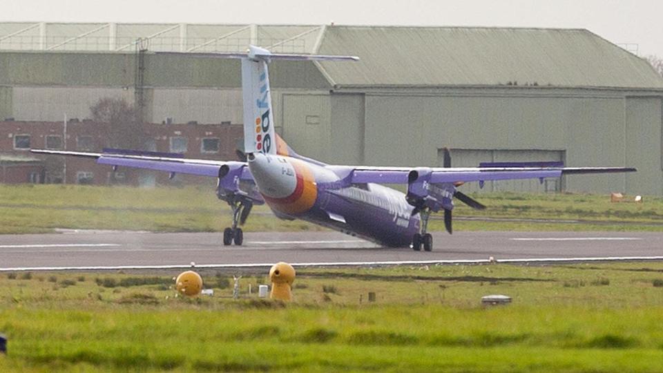  The Flybe plane declared an emergency on board after taking off from Belfast this morning. It is seen with its nose on the tarmac after crash landing