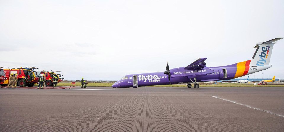  Dramatic pictures show the Bombardier Dash 8 Q400 after it skidded onto the tarmac at Belfast Airport