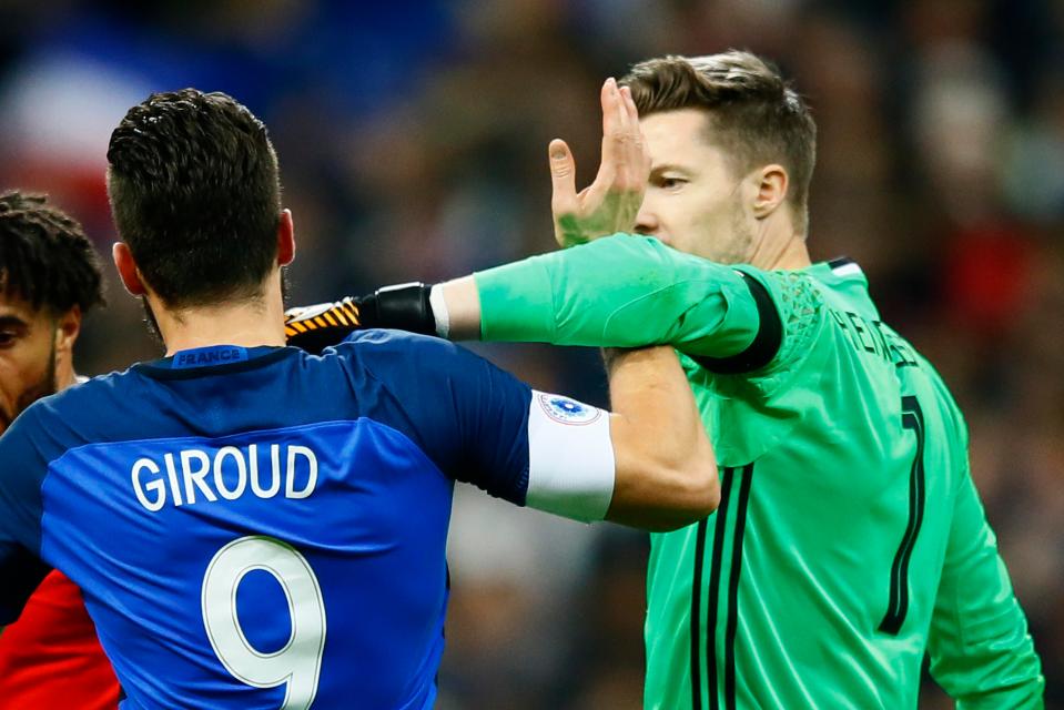  Welsh shot-stopper Wayne Hennessey clashes with Arsenal star Olivier Giroud