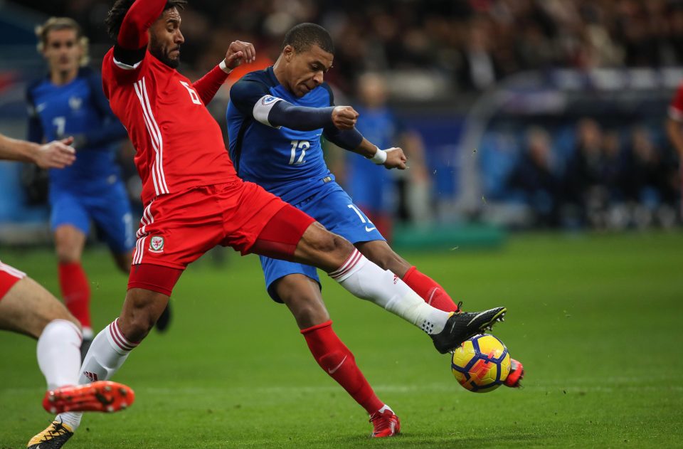  Kylian Mbappe in action against Ashley Williams at Stade de France