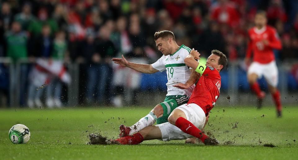  Jamie Ward battles for the ball against Switzerland's Stephan Lichtsteiner