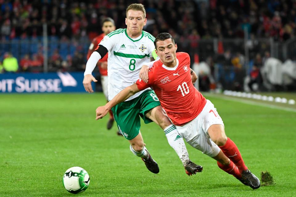  Arsenal's Granit Xhaka vies for the ball with Steven Davis