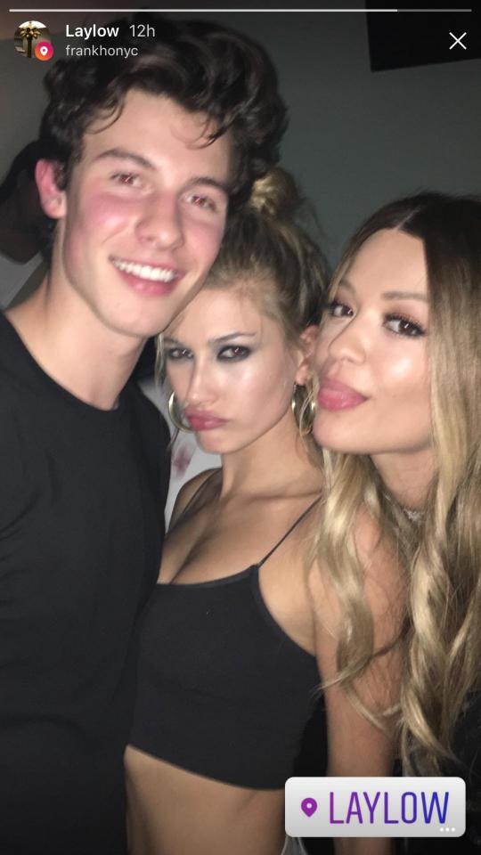  Shawn Mendes and Hayley Baldwin took a break from 'French kissing' to pose for a picture with the MTV EMAs host Rita Ora