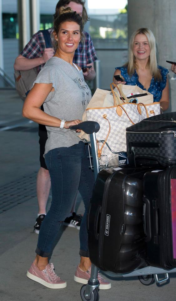  The WAG was pictured arriving in Brisbane today looking radiant and happy