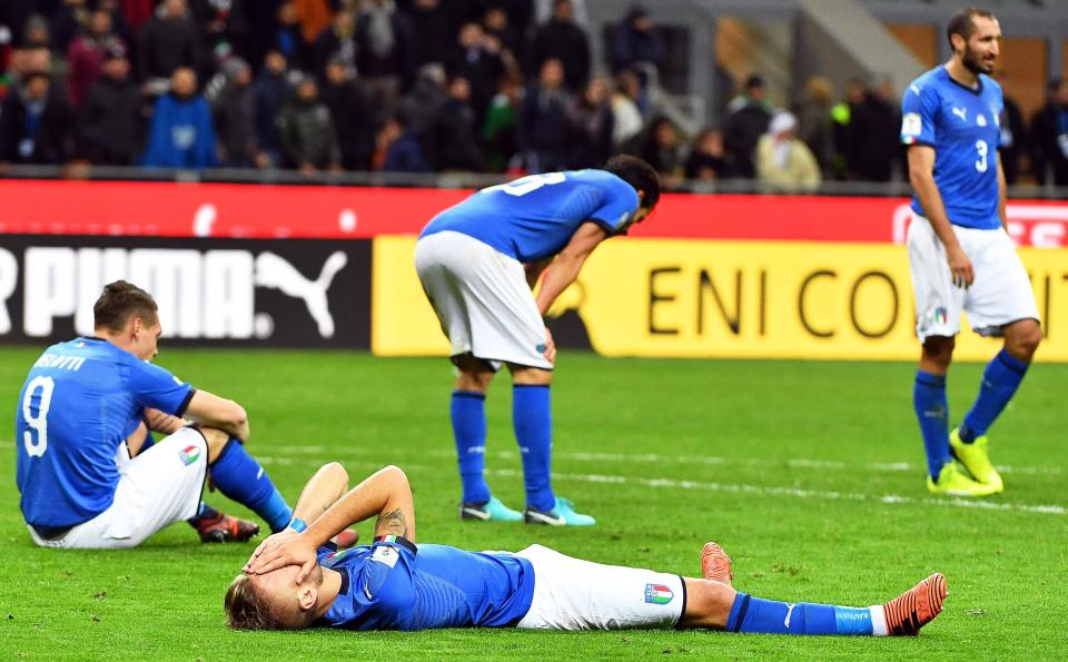  Italy players react after failing to qualify for the World Cup