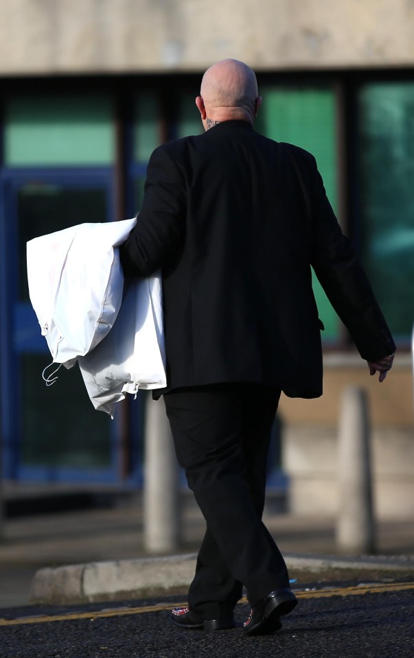 A pal delivers Charles Bronson’s wedding suit to HMP Wakefield this morning