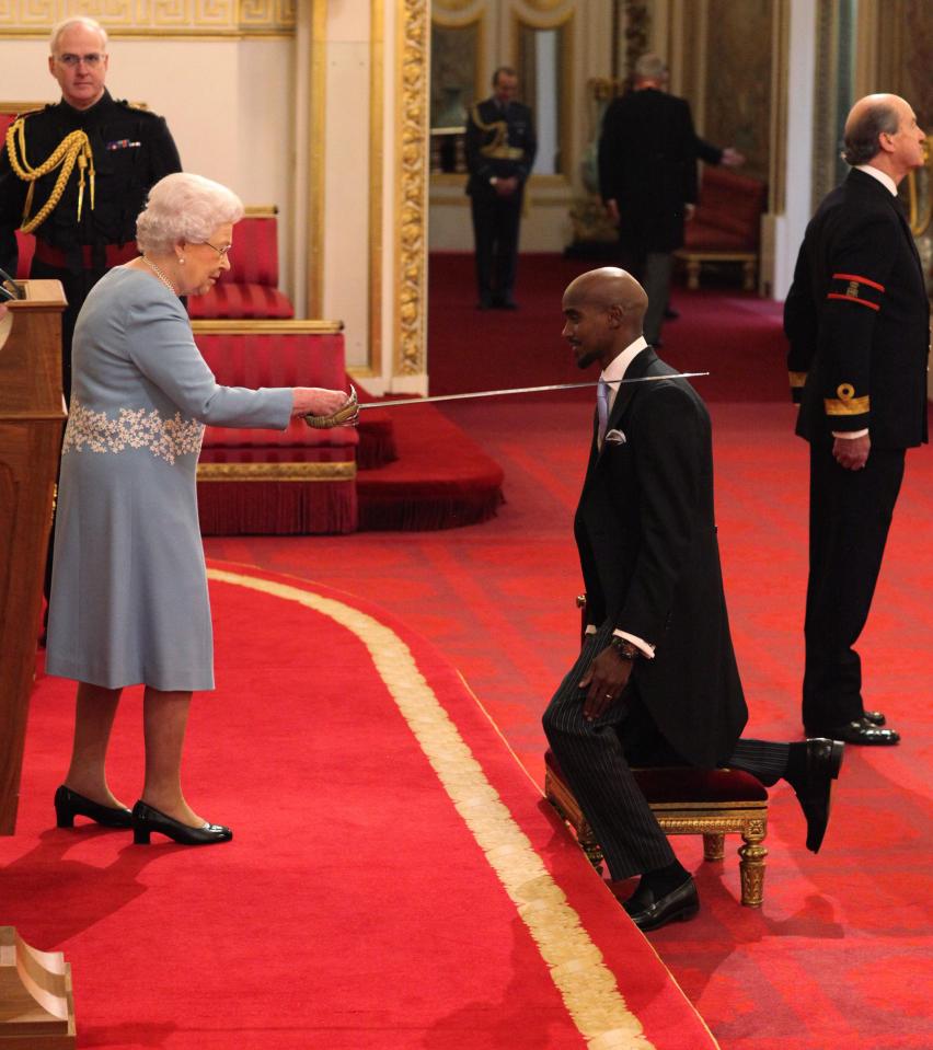  Mo Farah goes down on one knee to receive his knighthood from the Queen