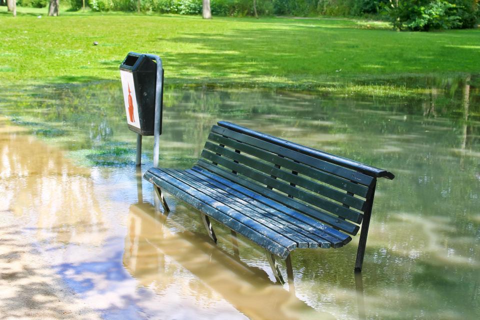  A park bench disappears under floodwater in the Dutch capital Amsterdam