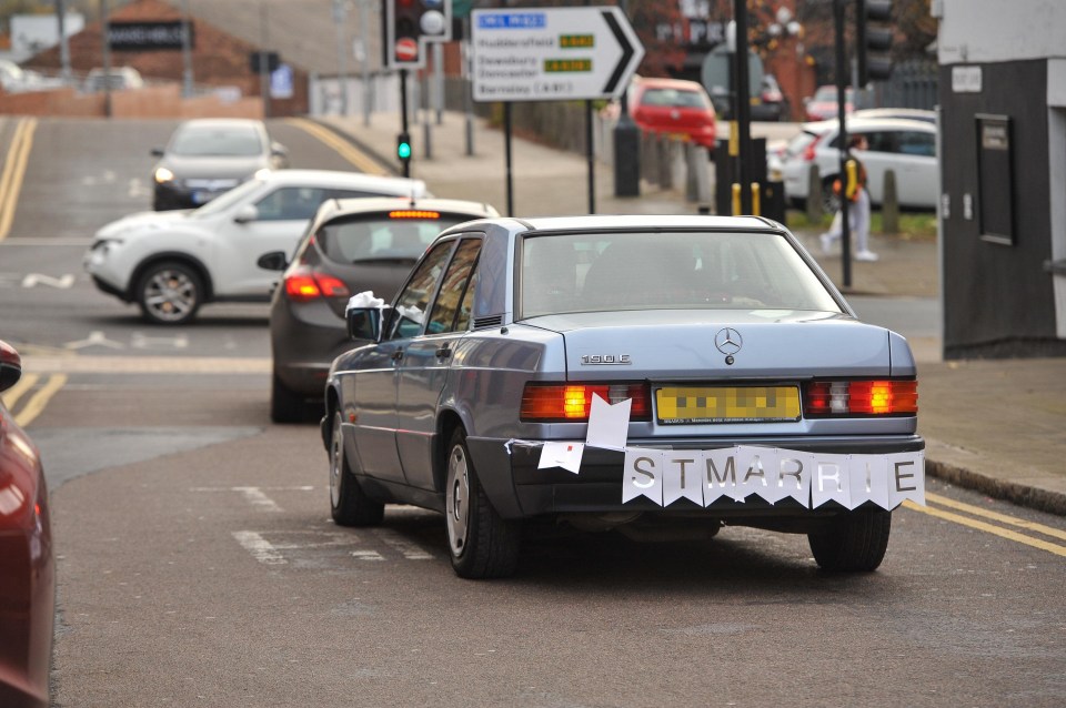 Paula was driven to the jail in a vintage silver-blue Mercedes with a Just Married banner on the back