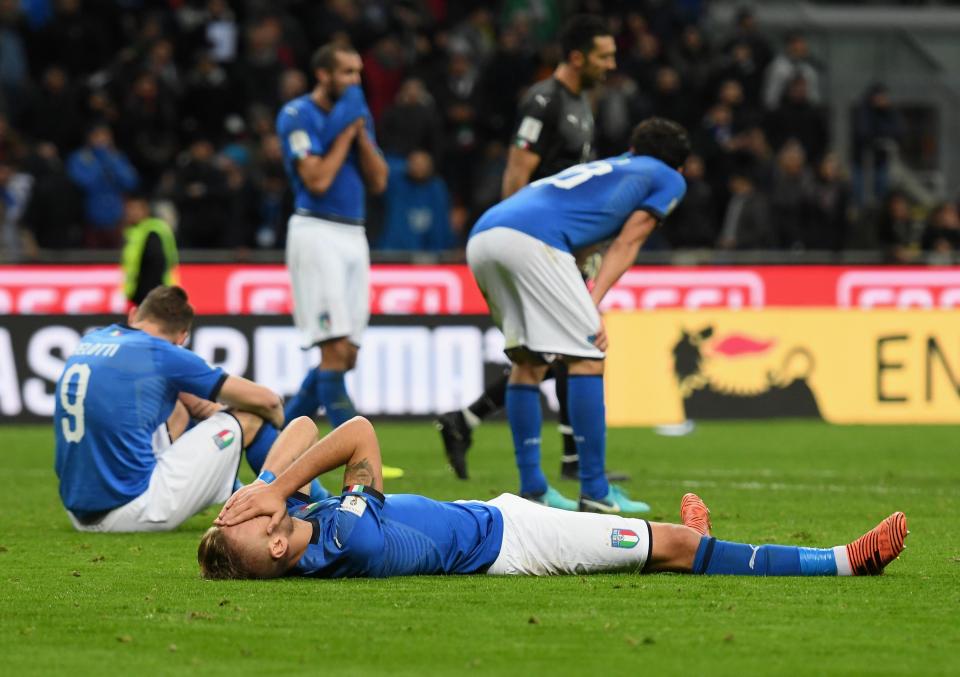  Italy players dejected after defeat to Sweden